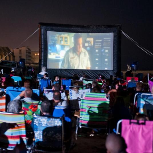 People enjoying an outdoor movie at Ocean City