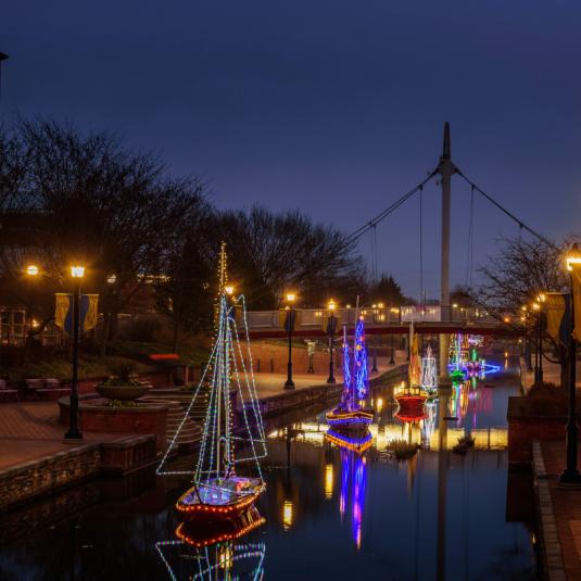 lighted boats on Carroll Creek in Frederick