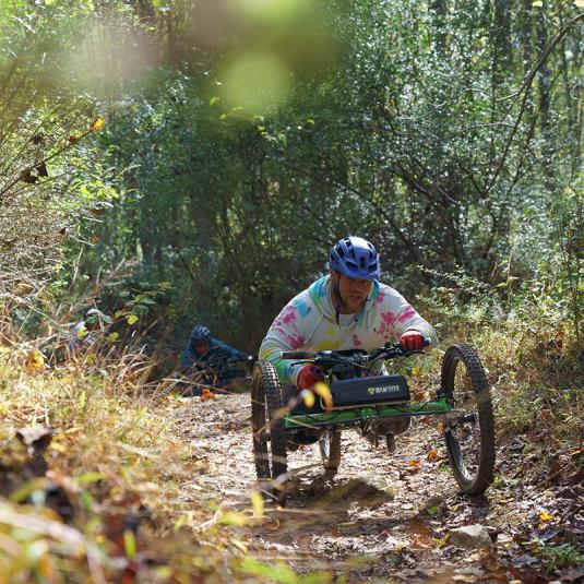 Hiker using adaptive hiking equipment