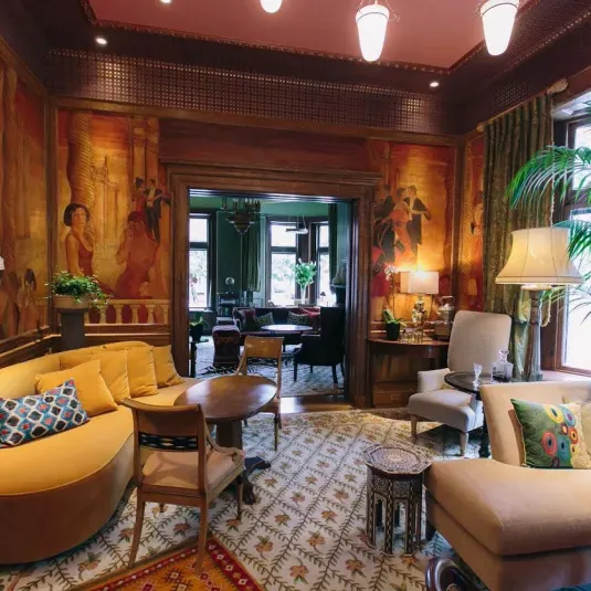 The Ivy Hotel's lush interior offers multiple places to relax in luxury