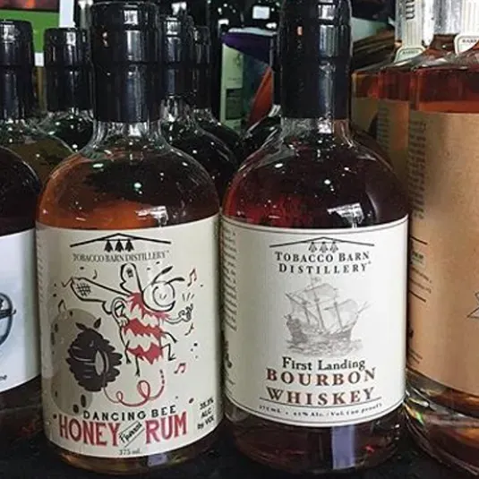 4 bottles of Tobacco Barn Distilling product