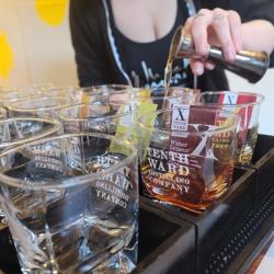 Tenth Ward mixologist prepping several spirit flights at once. Photo