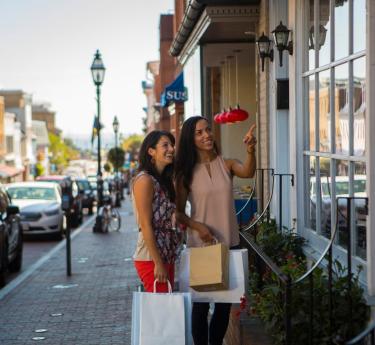 Two women shopping on Main Street in downtown Annapolis.