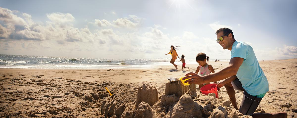 Building Sandcastle on the beach Building Sandcastle