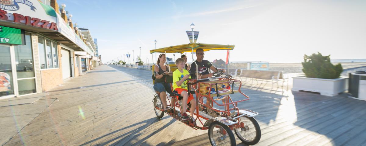 Surrey Ride on Ocean City Boardwalk family on pedal surrey on Ocean City Boardwalk